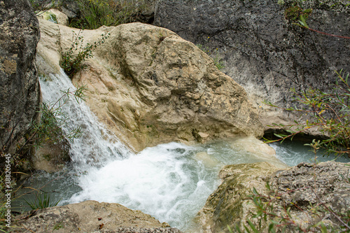 A waterfall in a river in South France. Forms white scum. Picture in landscape mode. © Photo-Graphia