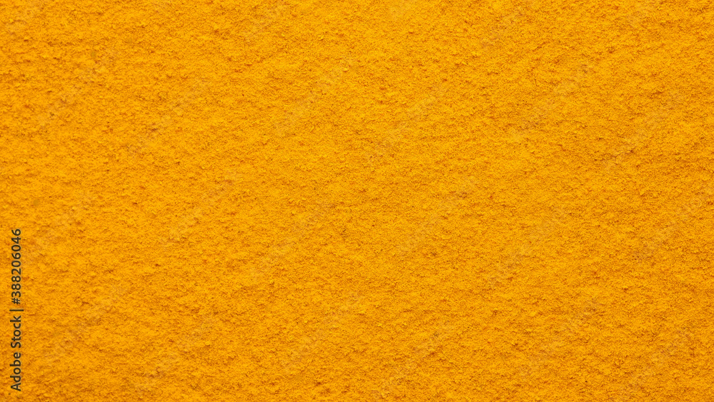 Fototapeta premium turmeric powder top view. Condiment or dietary supplement