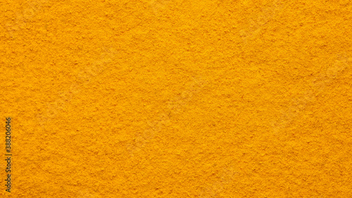 turmeric powder top view. Condiment or dietary supplement