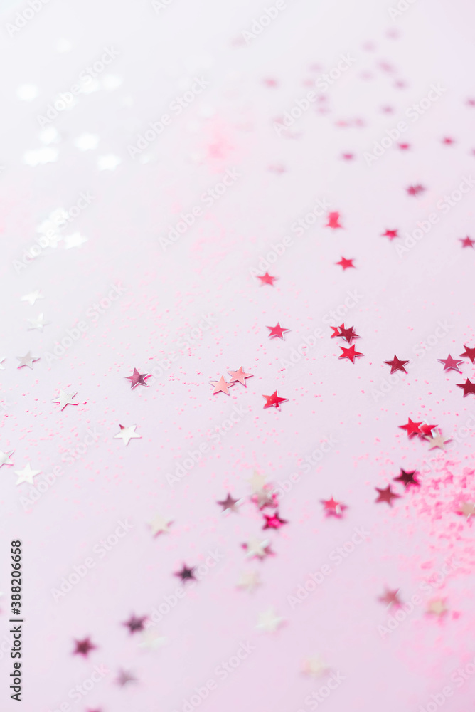 The background is pink with lots of silver stars and curlicues. The background is pink with lots of silver stars and curlicues.