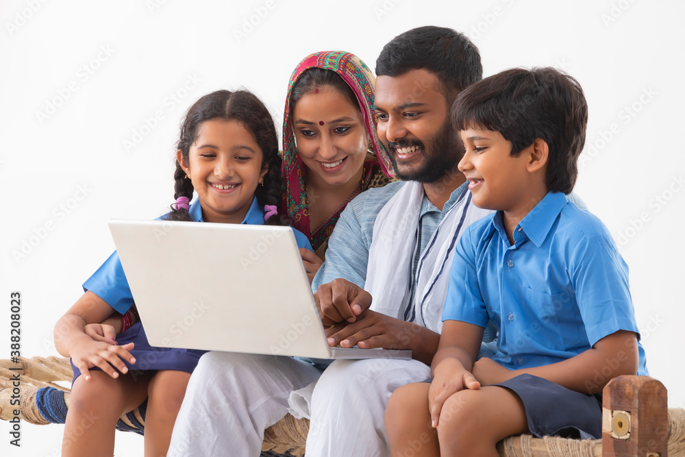 PORTRAIT OF A RURAL FAMILY USING A LAPTOP
PORTRAIT OF A RURAL FAMILY USING A LAPTOP