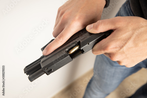 man with black pistol gun