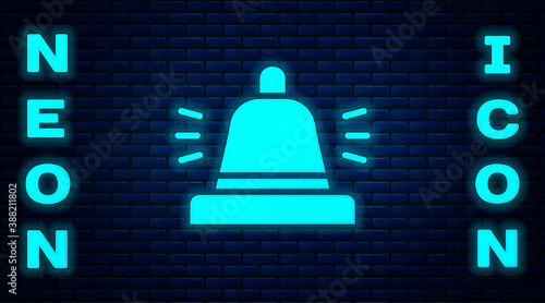 Glowing neon Hotel service bell icon isolated on brick wall background. Reception bell. Vector.
