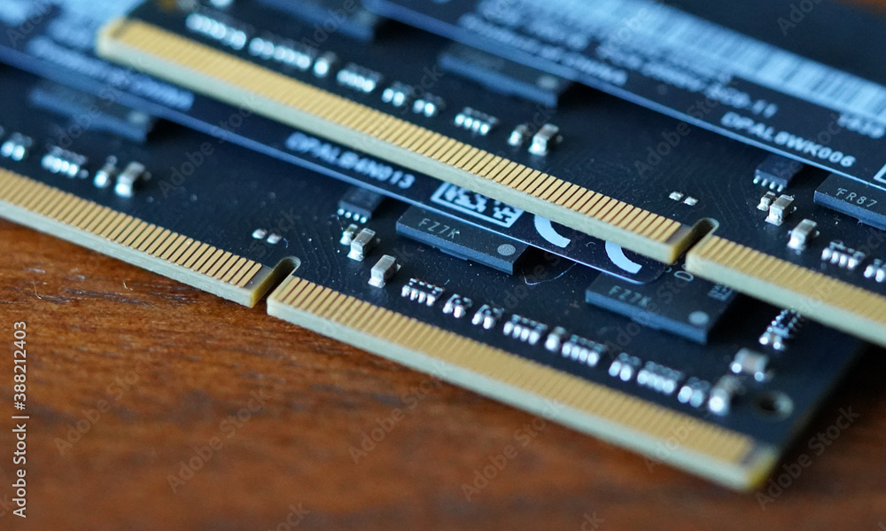 Computer Memory RAM random access memory. High quality photo. Close up shot of microchips on wood table. Computer Memory RAM random access memory. High quality photo. Close up shot of microchips on wood table.