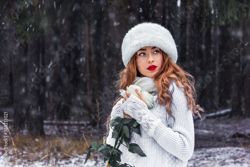 Beautiful girl in a white fur hat in the forest. Fabulous photo. Russian. In the role of Anna Karenina. New Year's, snowy photo session. © Irida