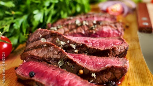 roast beef slices on wooden board