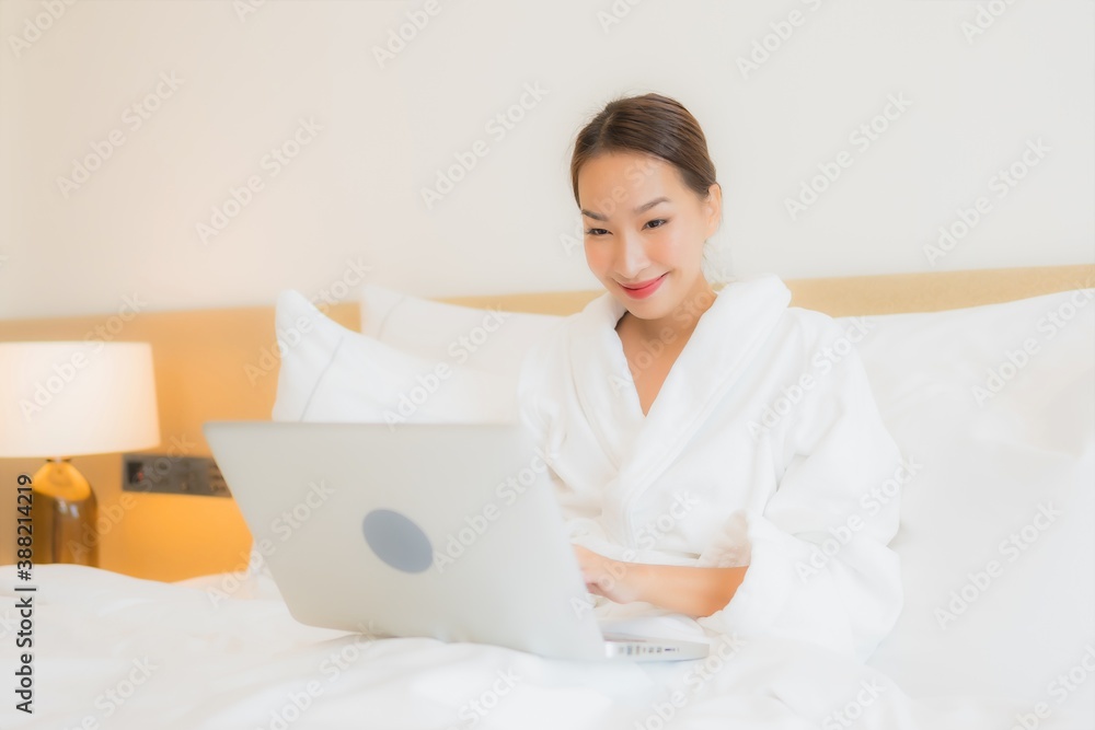 Portrait beautiful young asian woman use computer laptop on bed Portrait beautiful young asian woman use computer laptop on bed