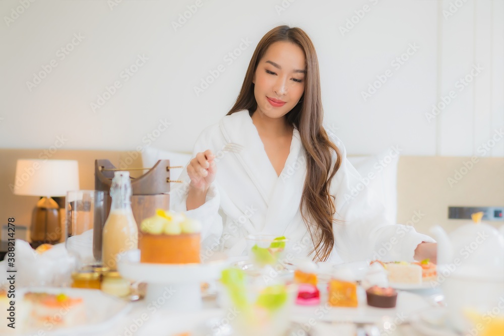 Portrait beautiful young asian woman enjoy with breakfast on bed Portrait beautiful young asian woman enjoy with breakfast on bed