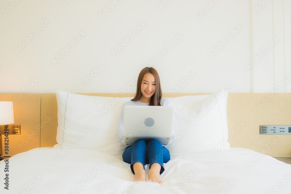 Portrait beautiful young asian woman use computer laptop on bed Portrait beautiful young asian woman use computer laptop on bed