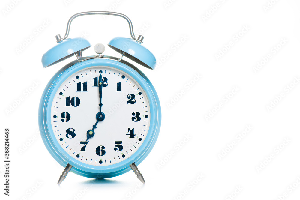 Classic table alarm clock light blue on a white background Classic table alarm clock light blue on a white background