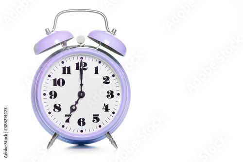 Classic purple table alarm clock on a white background