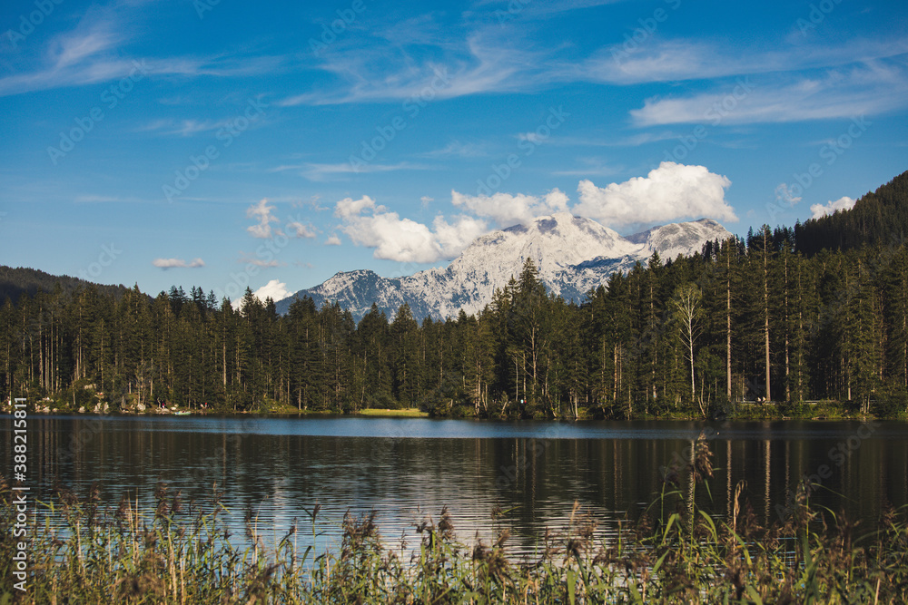 Hintersee in berchtesgaden bavaria. Scenic lake featuring boat rentals, surrounded by forests, hiking paths & mountain peaks