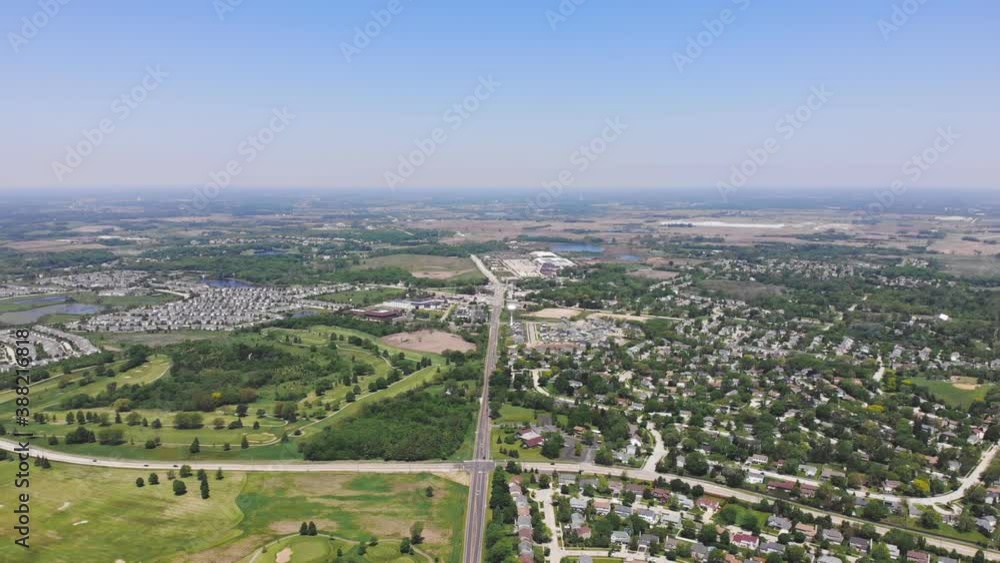 Aerial Flight over the houses of the city in America. Settlement in North America. Wonderful beautiful views of the cozy area from a bird's eye view. Aerial Flight over the houses of the city in America. Settlement in North America. Wonderful beautiful views of the cozy area from a bird's eye view.