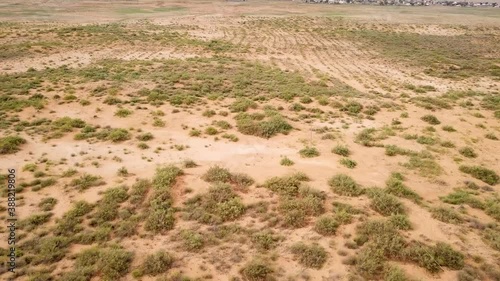Desert landscape. Dirt road that crosses a desert. Aerial view