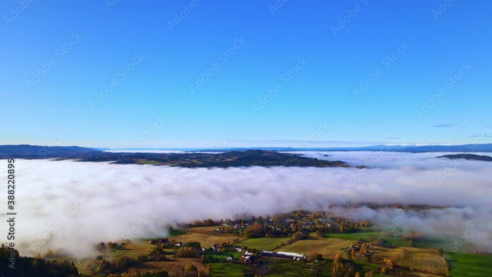 Heavy morning fog in a rural valley at sunrise. 4K aerial footage. Heavy morning fog in a rural valley at sunrise. 4K aerial footage.