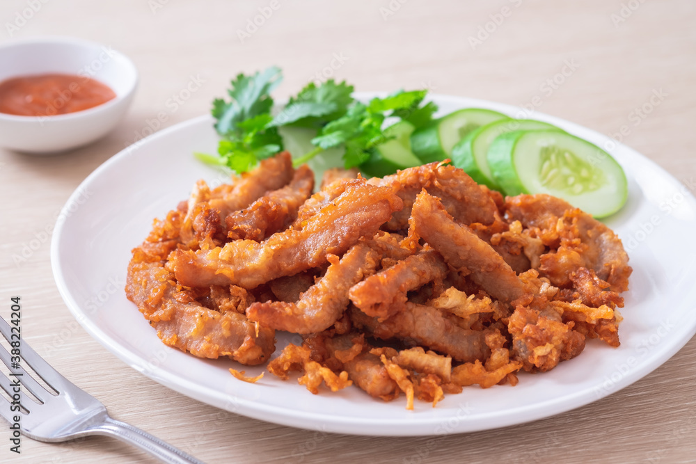 Fried pork with garlic and pepper on plate, Thai food.
