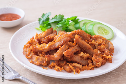 Fried pork with garlic and pepper on plate, Thai food.