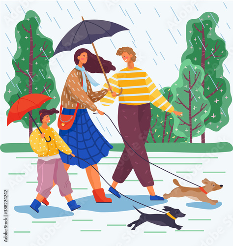 Happy family day walk with dogs in the park. Mom, dad and their daughter go out for a walk in the rain with the dogs and take umbrellas with them. Terrible lousy rainy weather during family weekend