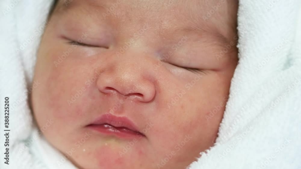 Close up and zoom out a sleeping cute Asian baby newborn Close up and zoom out a sleeping cute Asian baby newborn