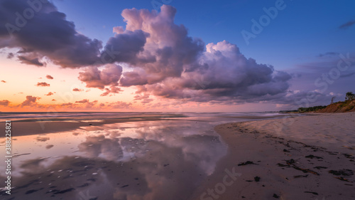  colorful sunset over the sea with beautiful clouds  reflection of clouds in the water