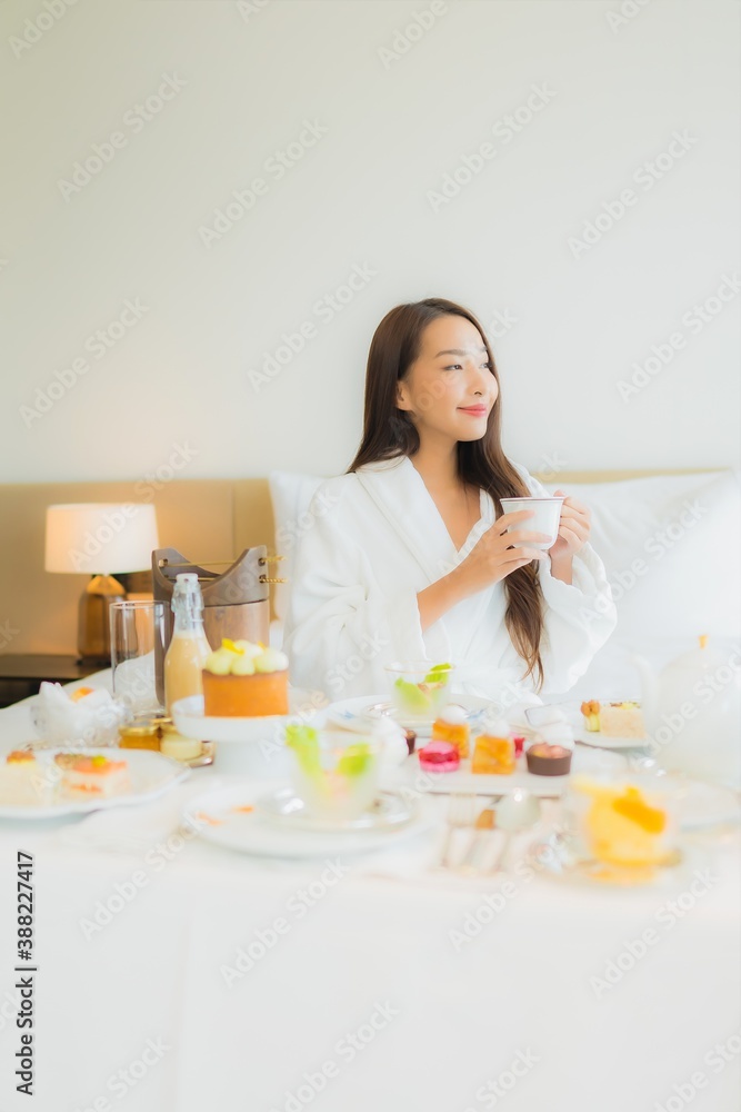 Portrait beautiful young asian woman enjoy with breakfast on bed Portrait beautiful young asian woman enjoy with breakfast on bed
