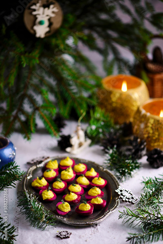 Beet deviled eggs on the New Year's table.style rustic.