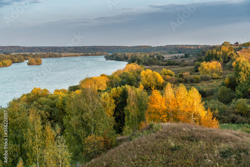 Oka river under blue sky on sunny autumn day.