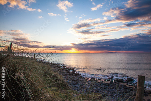 sunset over the ocean in ireland