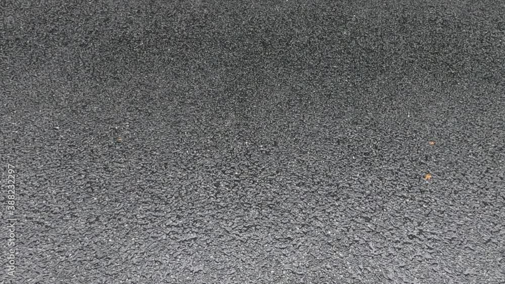 car driving in the rain on a wet road car driving in the rain on a wet road
