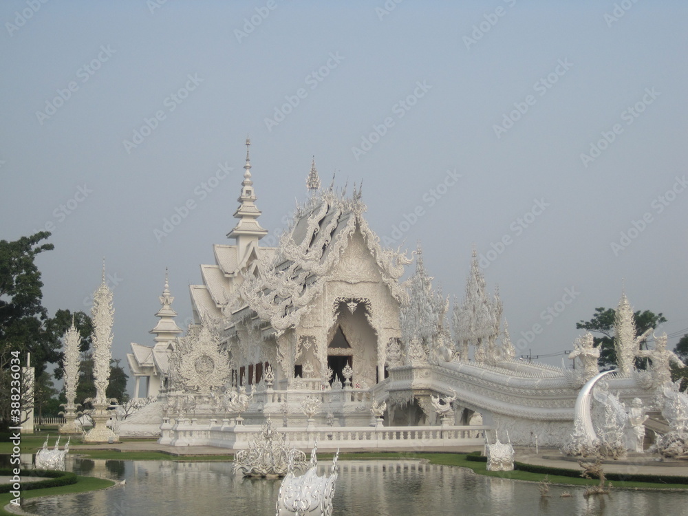 Exploring the Wat Rong Khun (White Temple) in Chiang Rai and the beaches and limestone cliffs of the Phi Phi Islands in Thailand