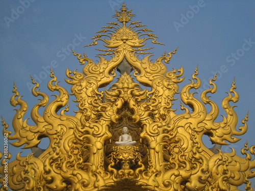 Exploring the Wat Rong Khun (White Temple) in Chiang Rai and the beaches and limestone cliffs of the Phi Phi Islands in Thailand
