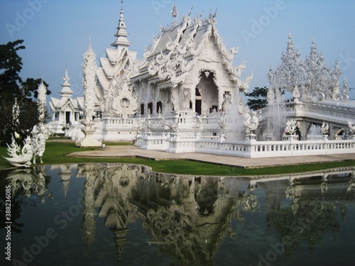 Exploring the Wat Rong Khun (White Temple) in Chiang Rai and the beaches and limestone cliffs of the Phi Phi Islands in Thailand © ChrisOvergaard