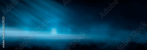 Dark cold wet street  asphalt  neon light. Reflection of neon in water. Empty night street scene  night city  smoke. abstract dark empty scene abstract night landscape neon blue light  silhouettes