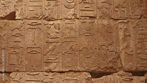 Stone wall with ancient Egyptian hieroglyphs