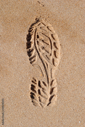 Close Up of Isolated Mark of Shoe Sole in Sandy Beach 