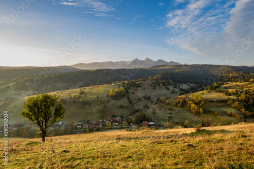 Iconic autumn colourful landscape photo of the village under the mountains. Travelling concept background. Super image of morning landscape. photo