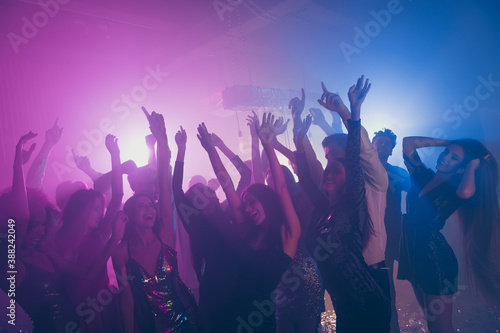 Photo of big group many classy fancy chic raise hands funny neon bright pink spotlight modern club indoors