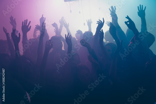 Photo of big company many carefree people raise arms concert wear stylish trendy outfit modern club indoors