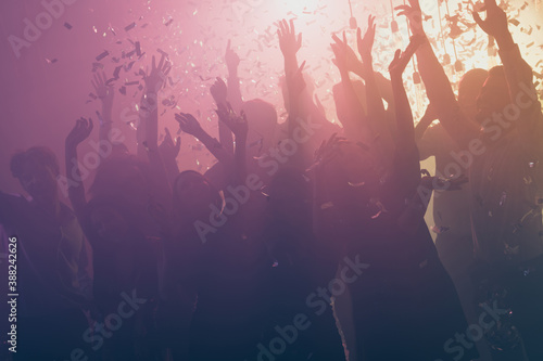 Photo of big loud group people rise hands fall confetti wear stylish trendy outfit modern club indoors