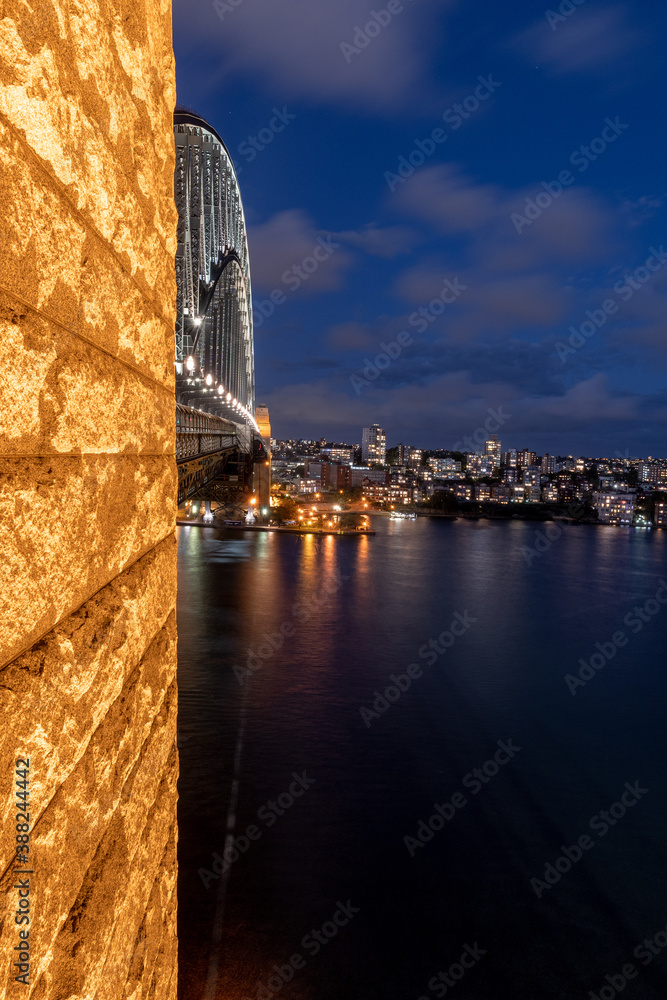 Sydney harbour bridge at night just after sunset with view of Kirribilli