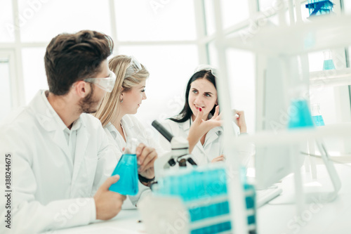 rear view.a group of scientists working in a modern laboratory