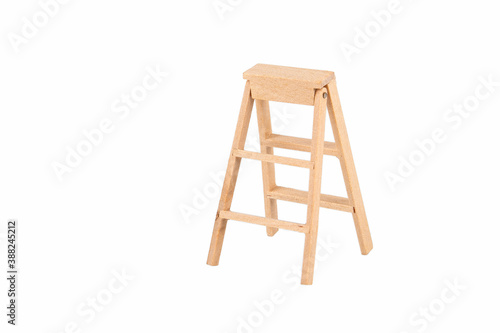 Wooden stairs isolated on a white background. Miniature figure
