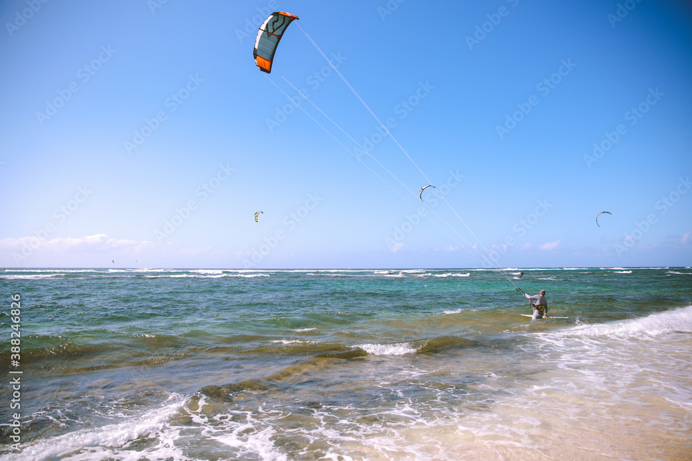 Kiteboarding at Mokuleia Beach Park, Oahu, Hawaii. Kiteboarding or