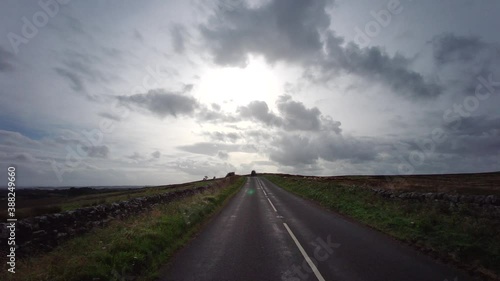 The A68 is a major road in the United Kingdom, running from Darlington in England to the A720 in Edinburgh. Driving on A68 road - Northumberland - United Kingdom - 18th of September 2020 photo