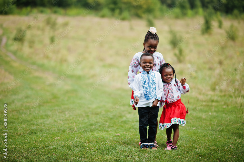 African kids in traditional clothes at park. African kids in traditional clothes at park.
