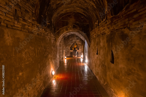 Wat Umong Suan Puthatham is a Buddhist temple in the historic centre, Buddha statue in the old cave of Wat Umong in Chiang Mai, Thailand.