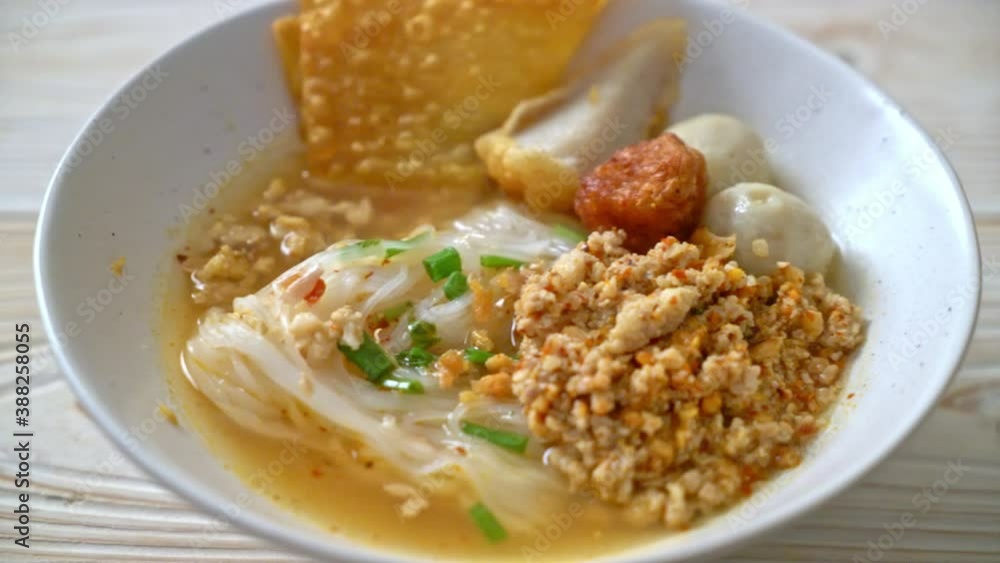 spicy noodles with fish ball and minced pork (Tom Yum Noodles) - Asian food style spicy noodles with fish ball and minced pork (Tom Yum Noodles) - Asian food style