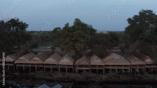 Wallpaper Mural Flying pan over fishermen house and flocks of white birds flying over basin in Cambodia Torontodigital.ca