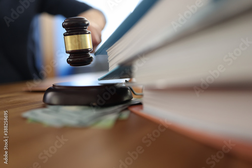 Tableau sur toile Wooden gavel for judge on table next to folder with documents