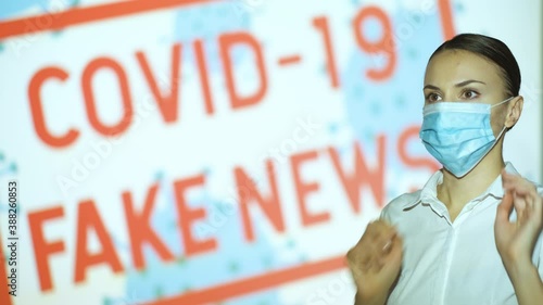 Beautiful girl puts on and takes off her mask, gets the latest information on the epidemic when she finishes the pandemic and lockdown, covid 19 fake news